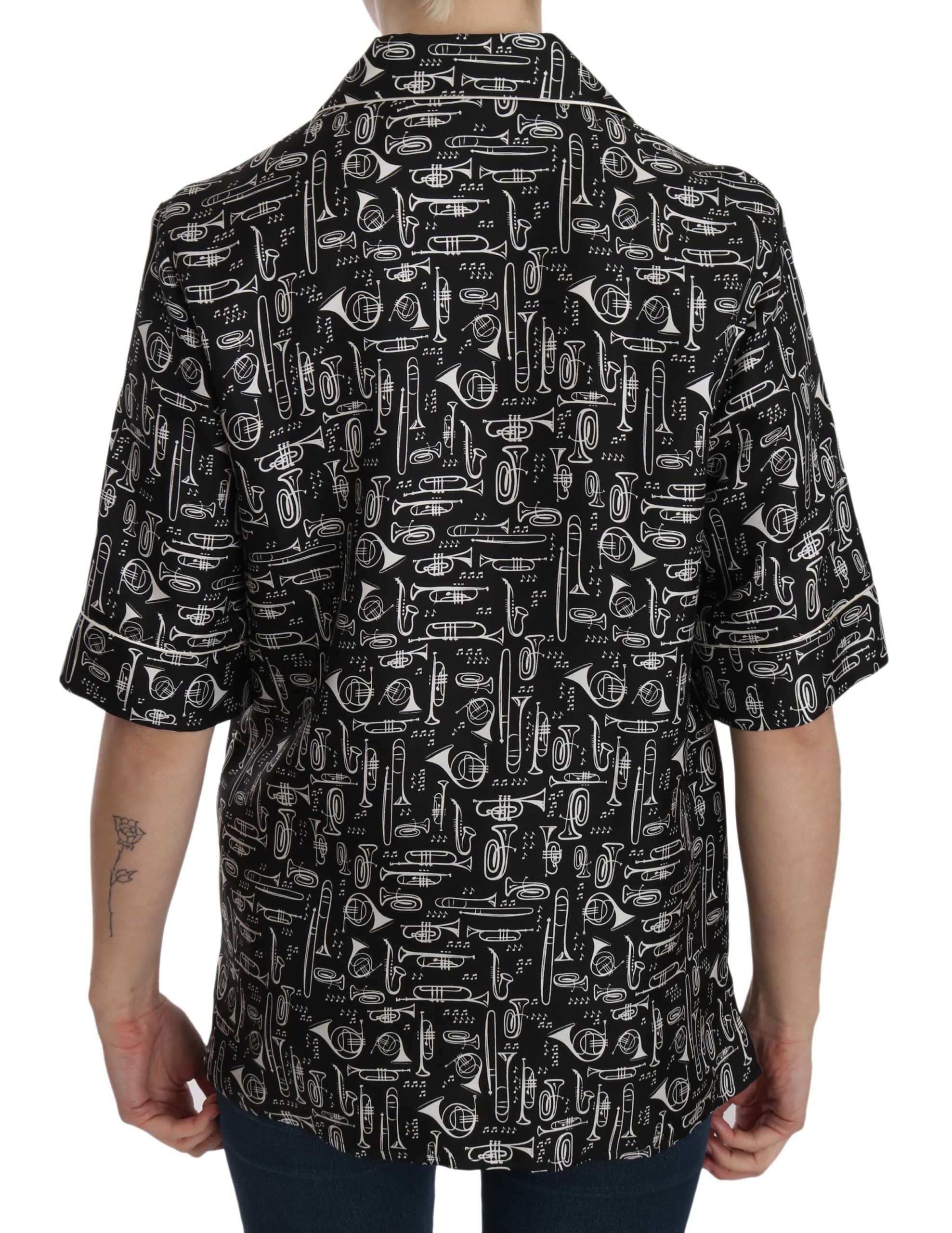 Haut en soie noir Dolce & Gabbana avec impression d'instruments de musique, style élégant et graphique.