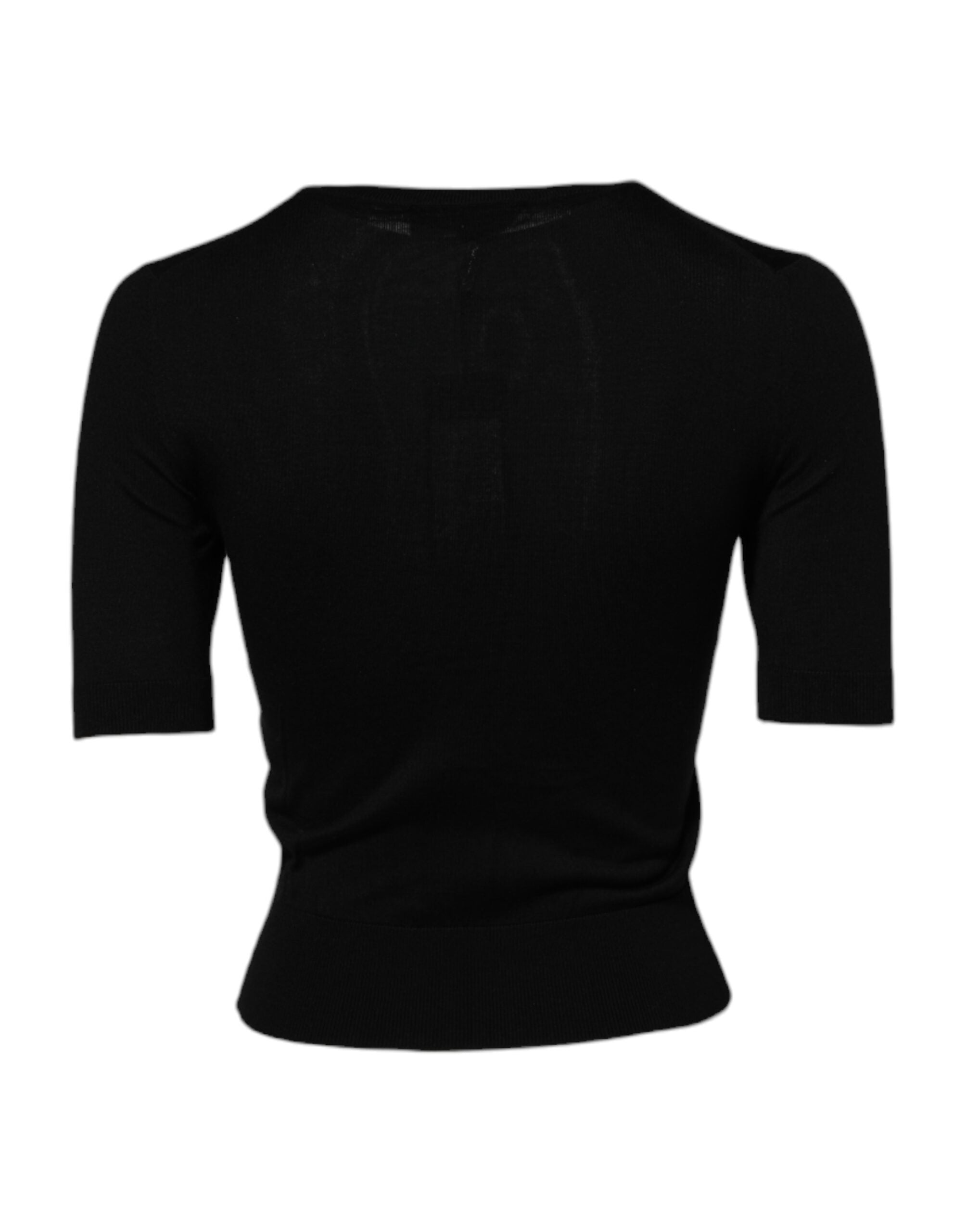 Blouse noire Dolce & Gabbana avec embellissements de sequins en forme de roses, élégant haut à manches longues.