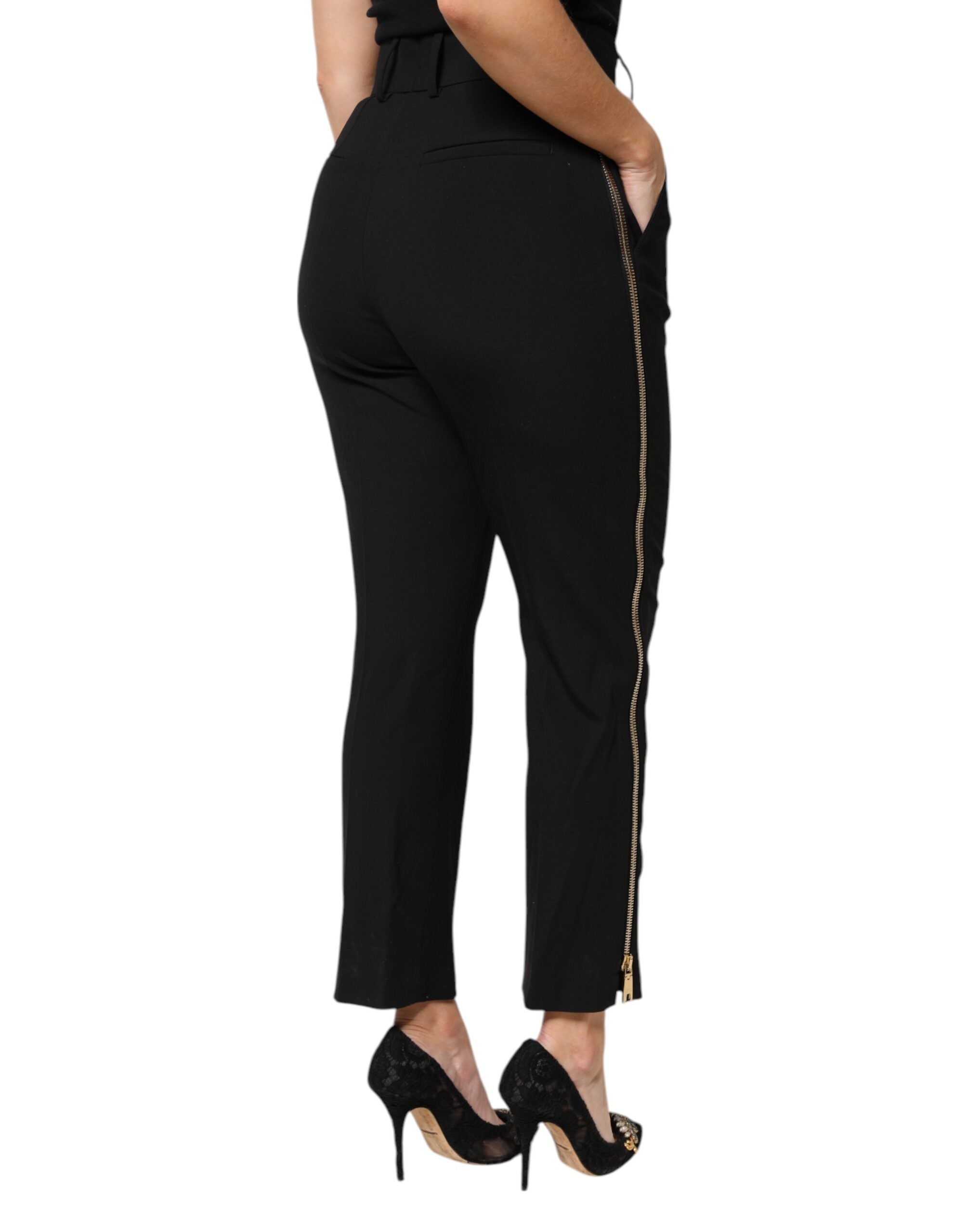 Pantalon tapered en laine noire de Dolce & Gabbana avec taille haute et fermeture éclair, vue de face.