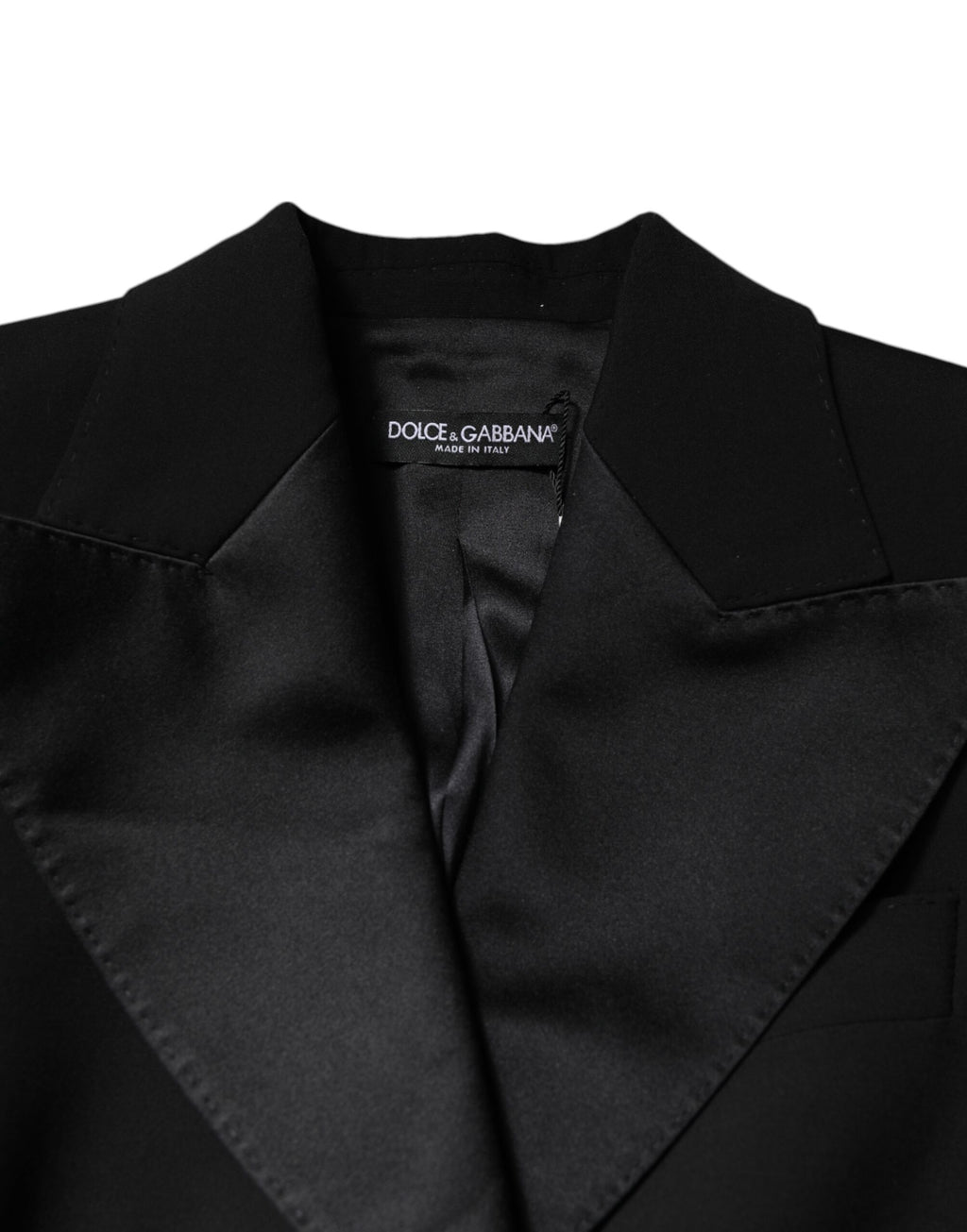 Combinaison noire en laine de Dolce & Gabbana pour femme, avec veste ou manteau élégant, portée longue et sophistiquée.