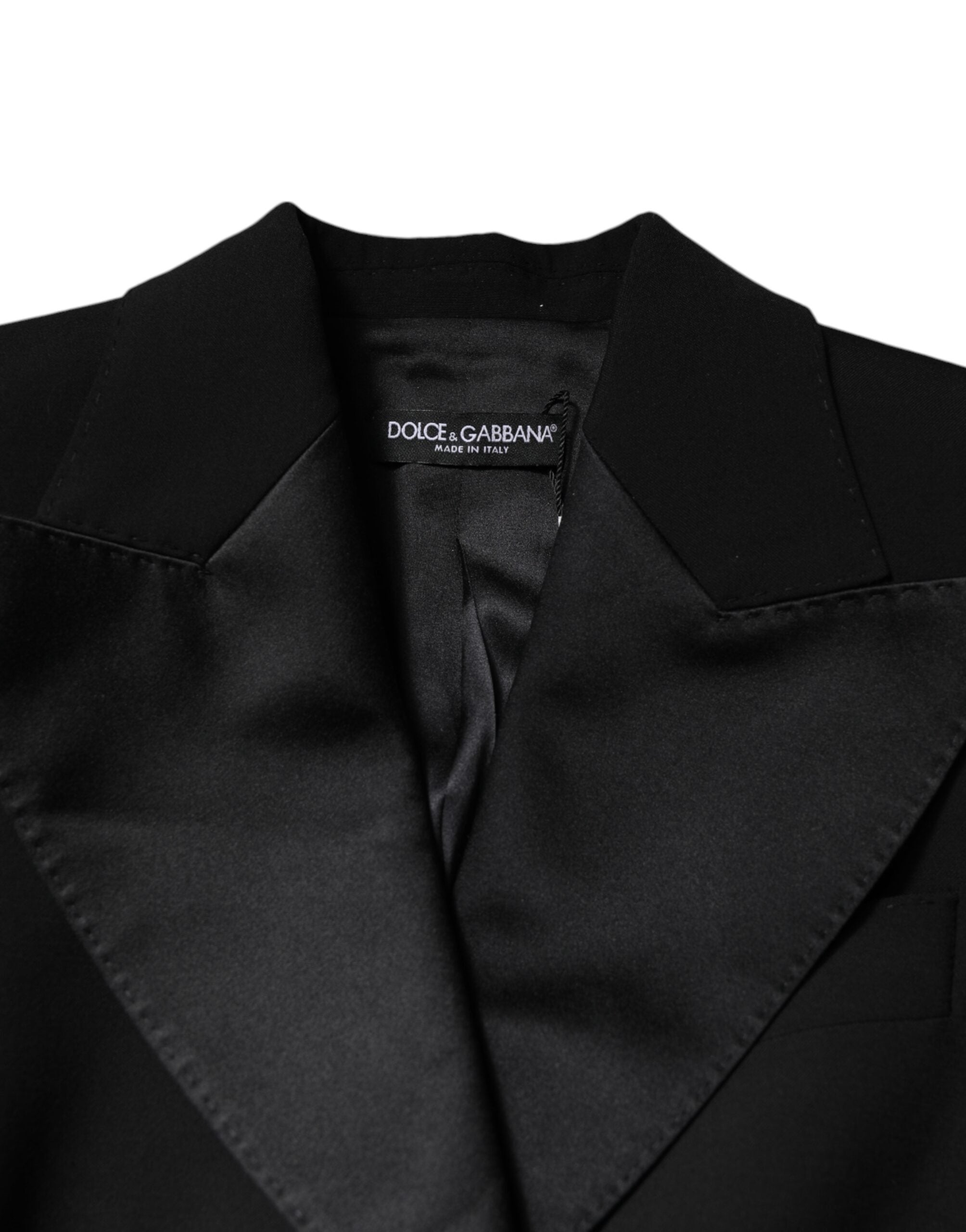 Combinaison noire en laine de Dolce & Gabbana pour femme, avec veste ou manteau élégant, portée longue et sophistiquée.