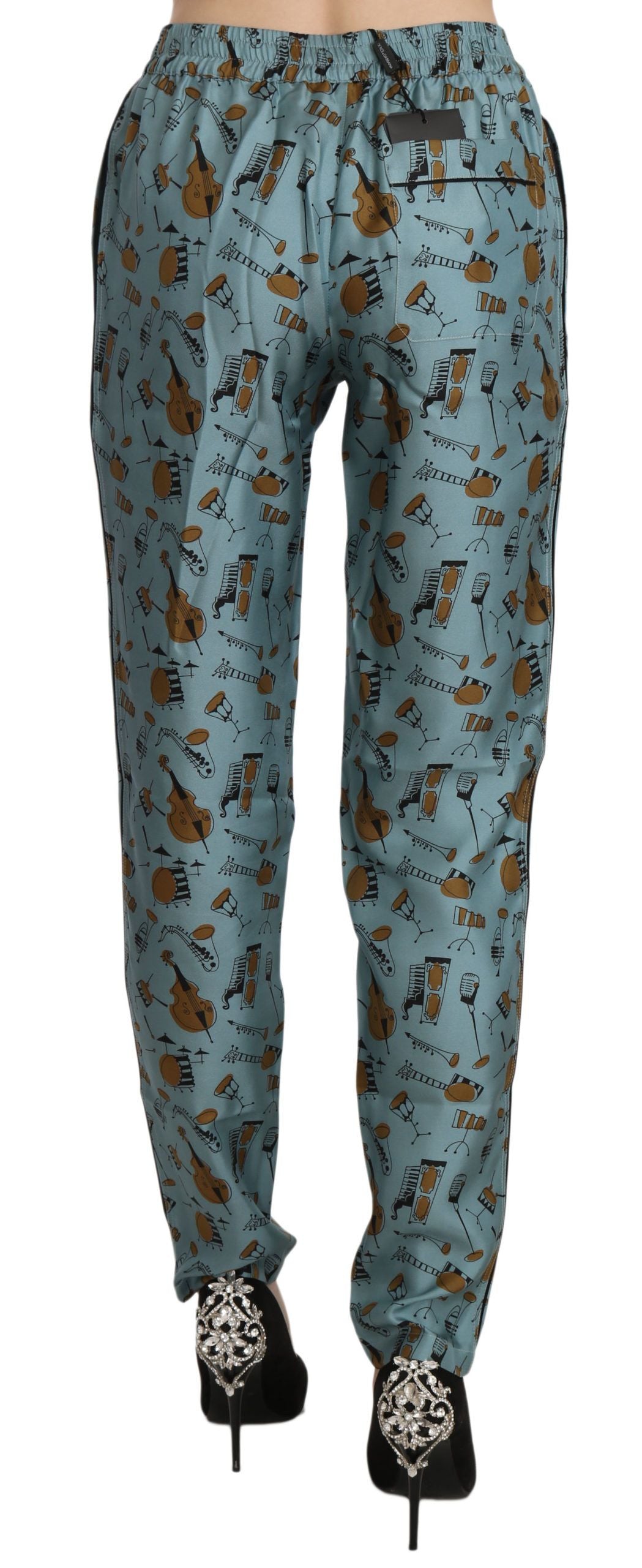 Pantalons fuselés Dolce & Gabbana à motif instruments de musique bleus, tissu élégant et design moderne.