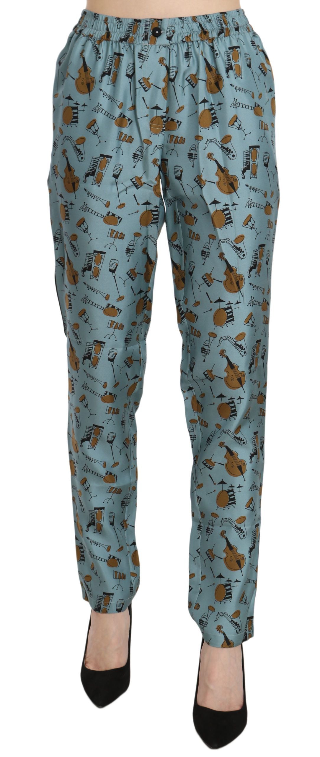 Pantalons fuselés Dolce & Gabbana avec motif d'instruments de musique bleus et designs colorés, en tissu léger.