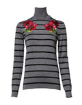 Pull à manches longues Dolce & Gabbana gris avec broderie florale, detail élégant et texture douce visible sur l'image.