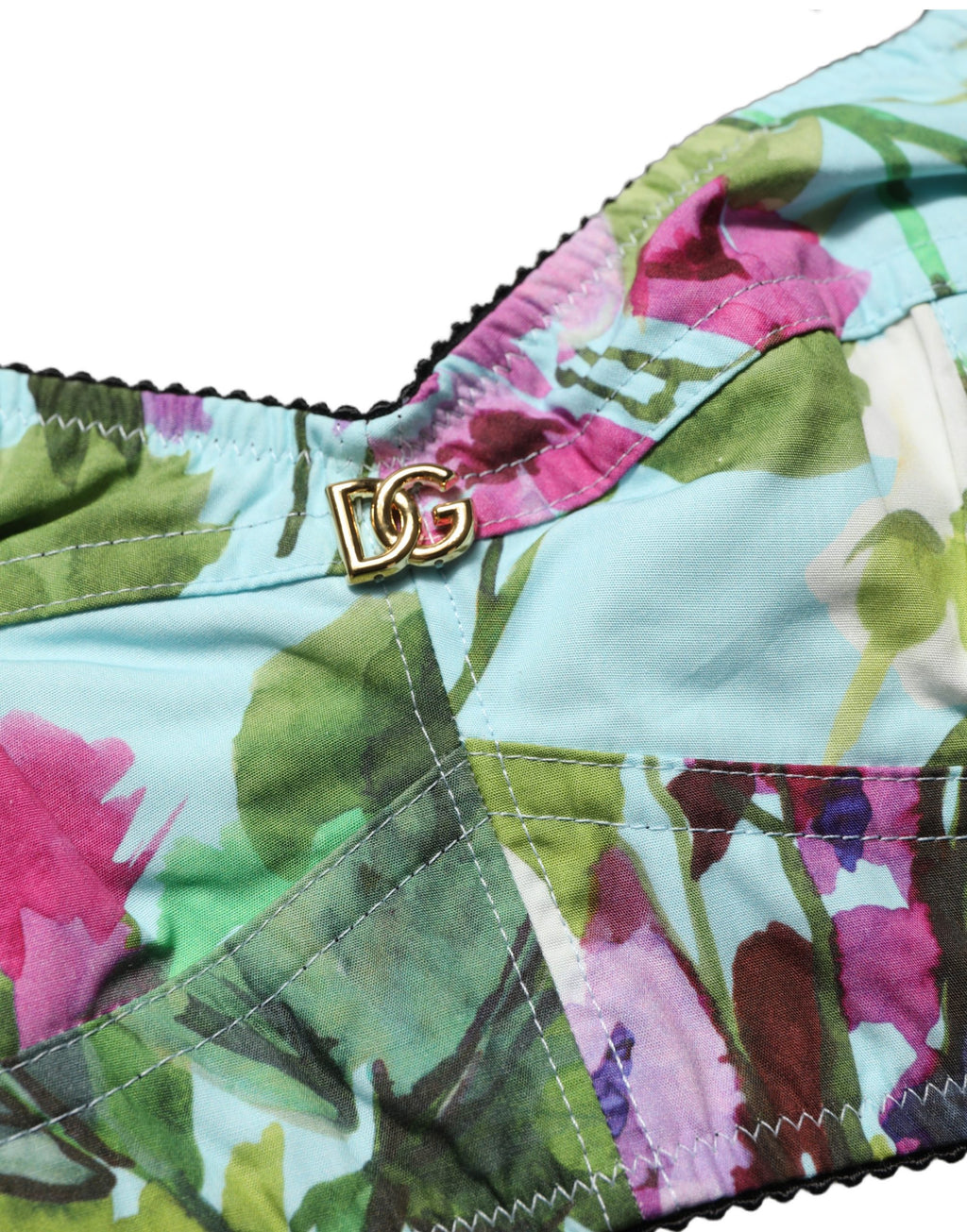 Top court Dolce & Gabbana à fleurs multicolores, bustier crop top en tissu léger et coloré avec motifs floraux.