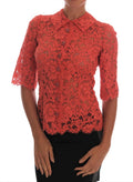 Blouse en dentelle florale Dolce & Gabbana avec boutons en cristal orange, élégante et raffinée.