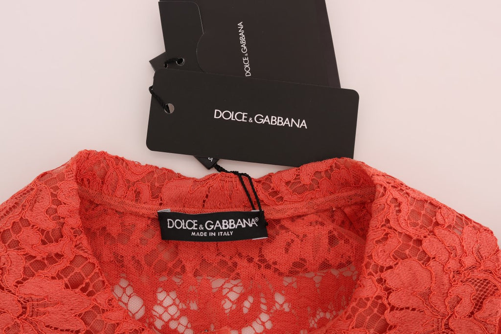Blouse en dentelle florale orange avec boutons en cristal Dolce & Gabbana, détail élégant et sophistiqué.