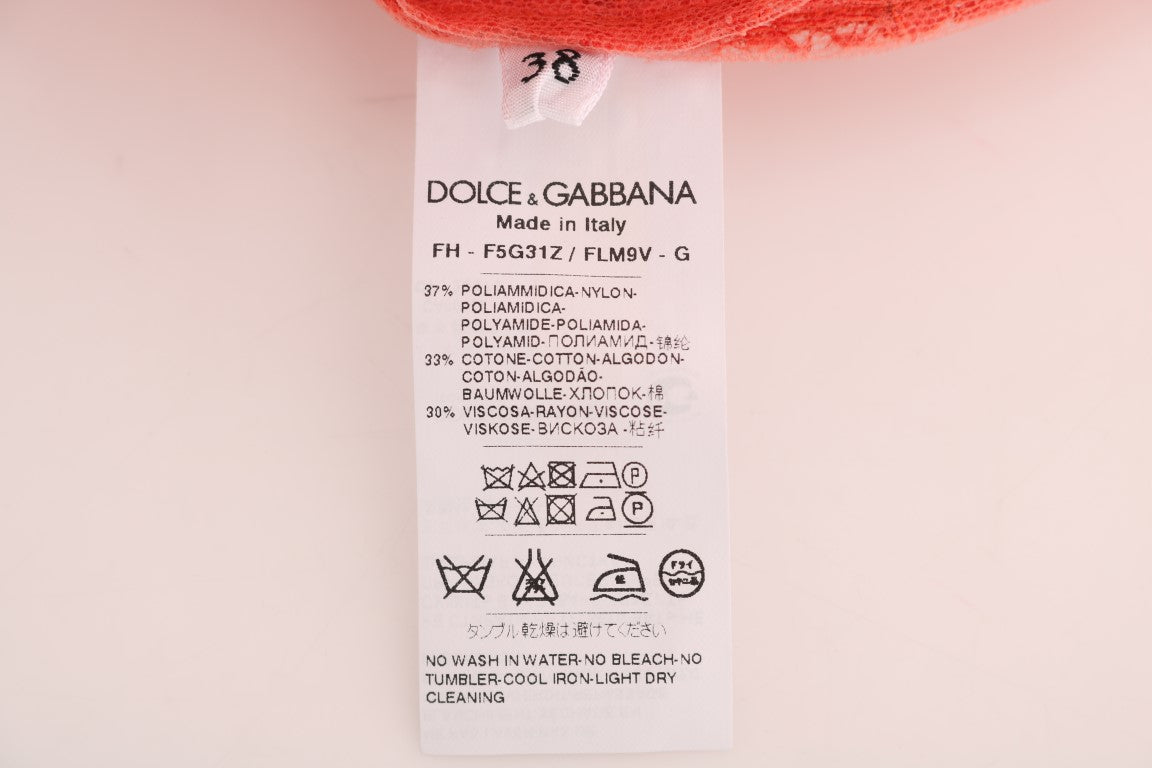 Blouse en dentelle florale avec boutons en cristal orange de Dolce & Gabbana, détails élégants et féminin.