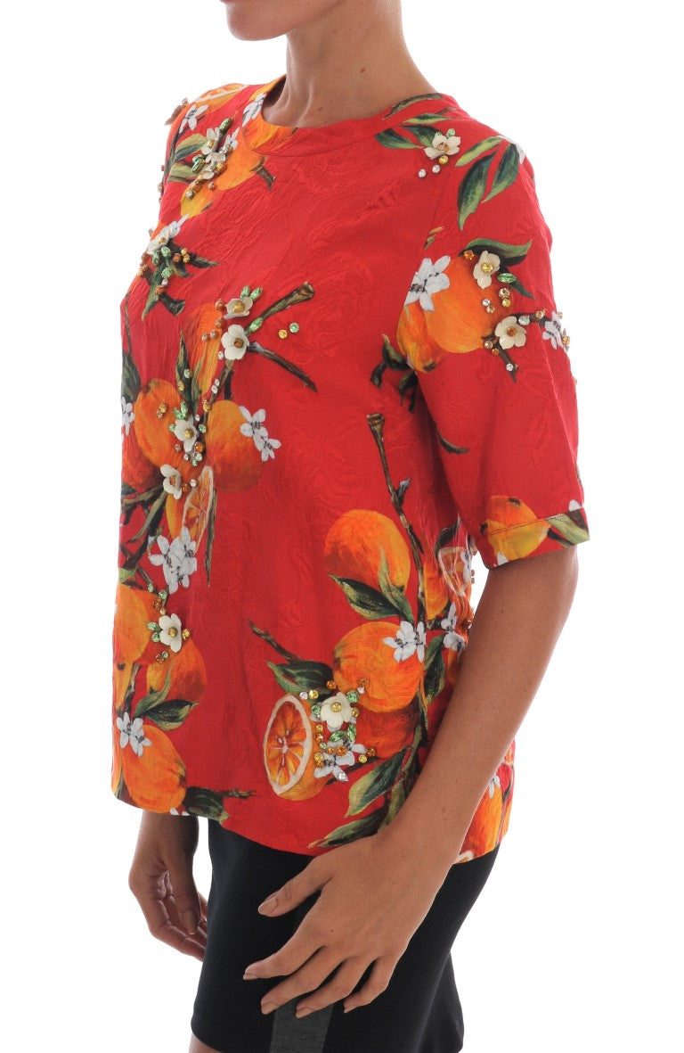 Chemise Dolce & Gabbana à imprimé orange avec cristaux ornés, élégante blouse en tissu léger.