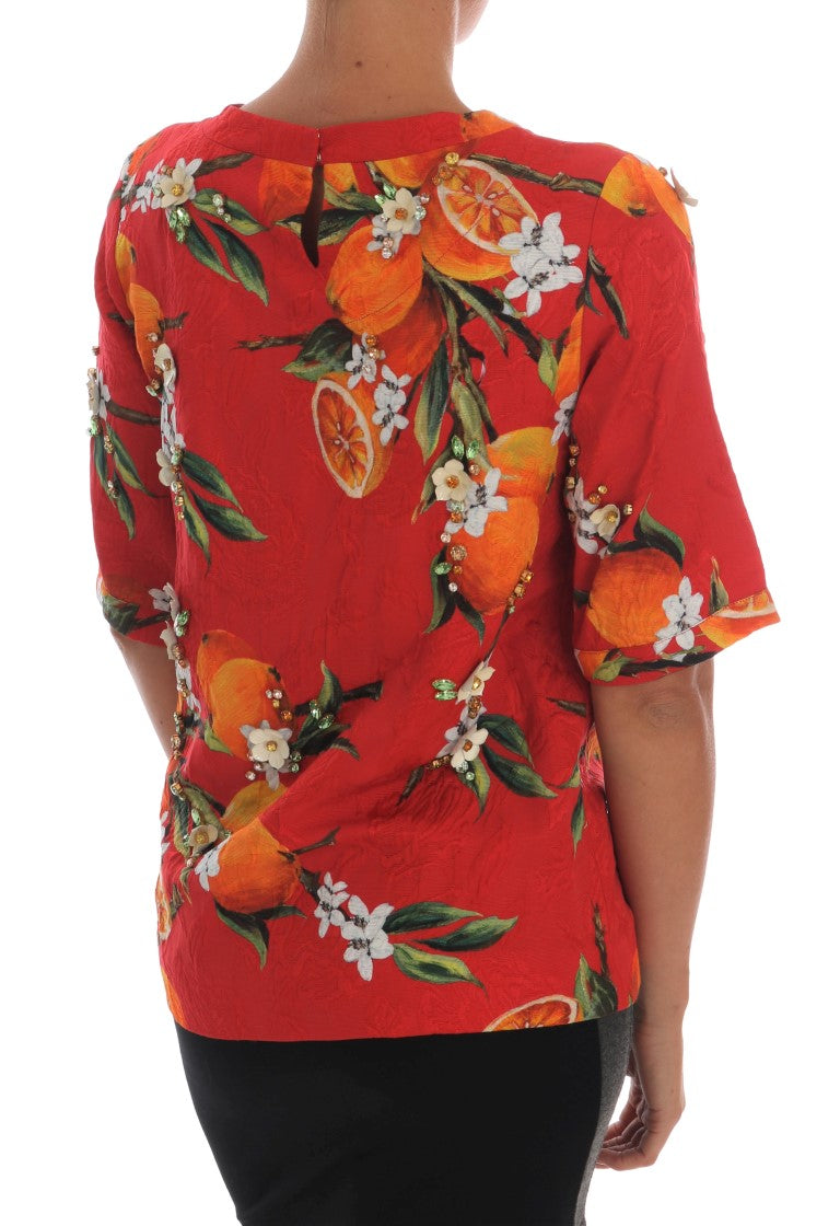 Blouse Dolce & Gabbana à imprimé orange avec cristaux, détail élégant et embellissements en cristal sur le haut.
