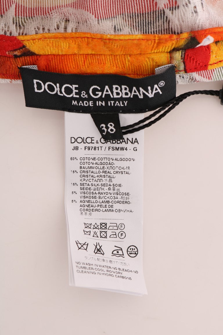 Blouse Dolce & Gabbana à imprimé orange avec cristaux ornant le col et les manches, en tissu fluide élégamment drapé.