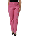 Jeans en denim rose Dolce & Gabbana, taille moyenne, déchirés et ajustés tapered, visibles en gros plan.