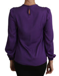 Blouse violette Dolce & Gabbana avec embellissements princesse et conte de fées, style élégant et féminin.