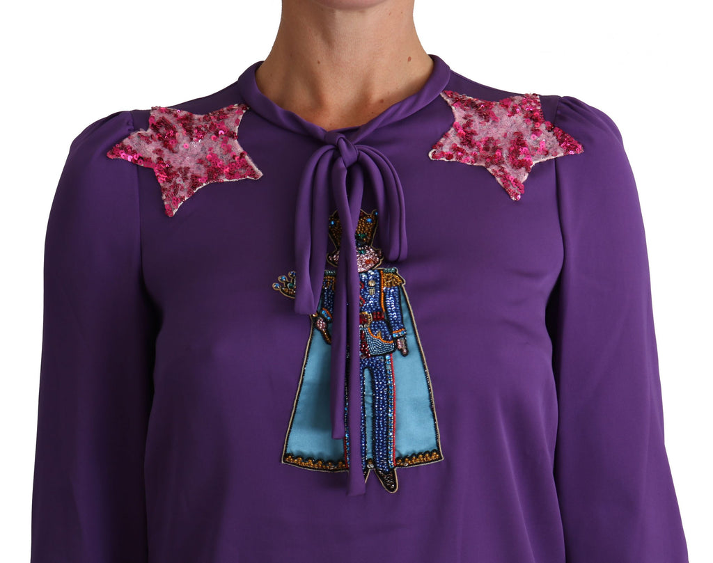 Blouse violette Dolce & Gabbana avec détails féerique et embellissements, style princesse et conte de fées.