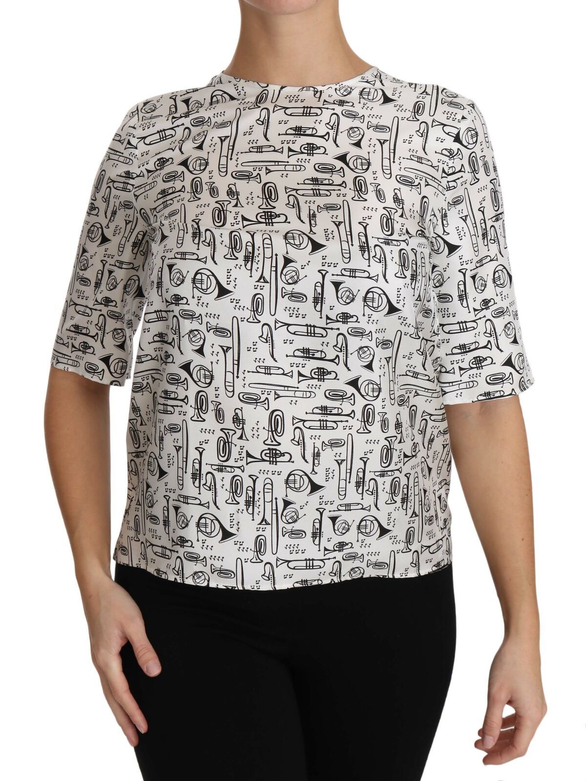 Blouse blanche Dolce & Gabbana avec imprimé d'instruments de musique, style élégant et moderne, en tissu léger.