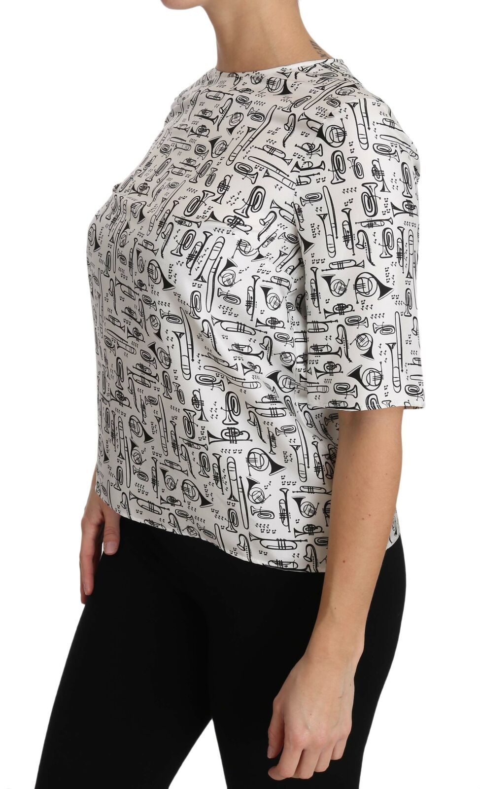 Blouse blanche Dolce & Gabbana avec imprimé d'instruments de musique, tissu léger et style élégant.