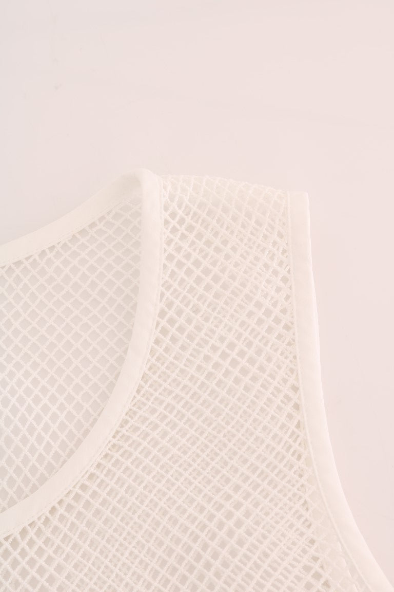 Top blanc en filet transparent de Dolce & Gabbana, débardeur en tissu fin et léger, mode élégante et raffinée.
