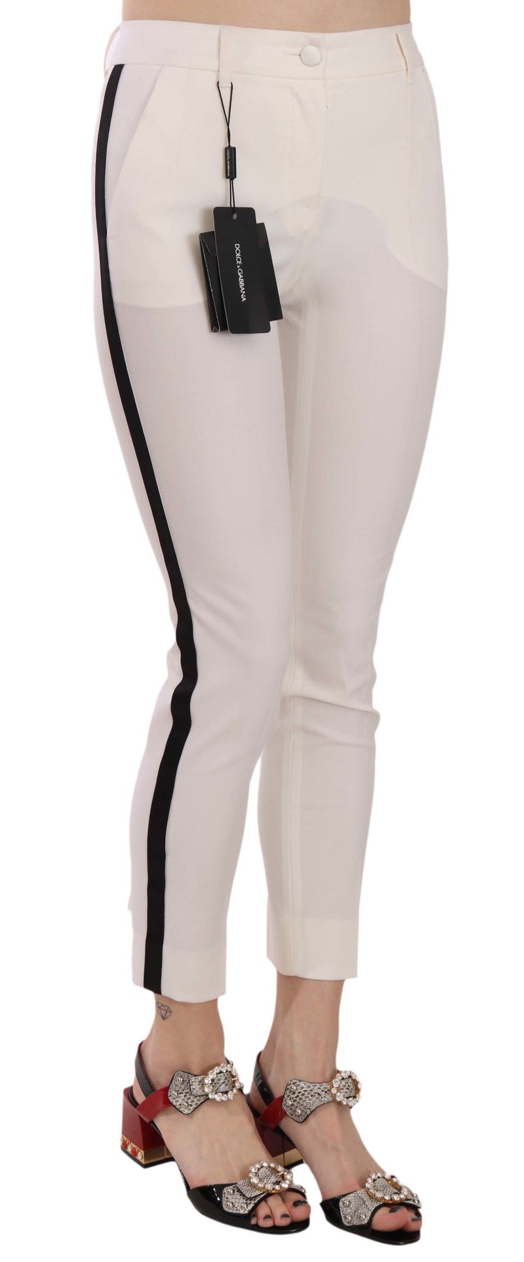 Pantalon skinny blanc Dolce & Gabbana avec rayures latérales, coupe courte, en tissu léger et élégant.