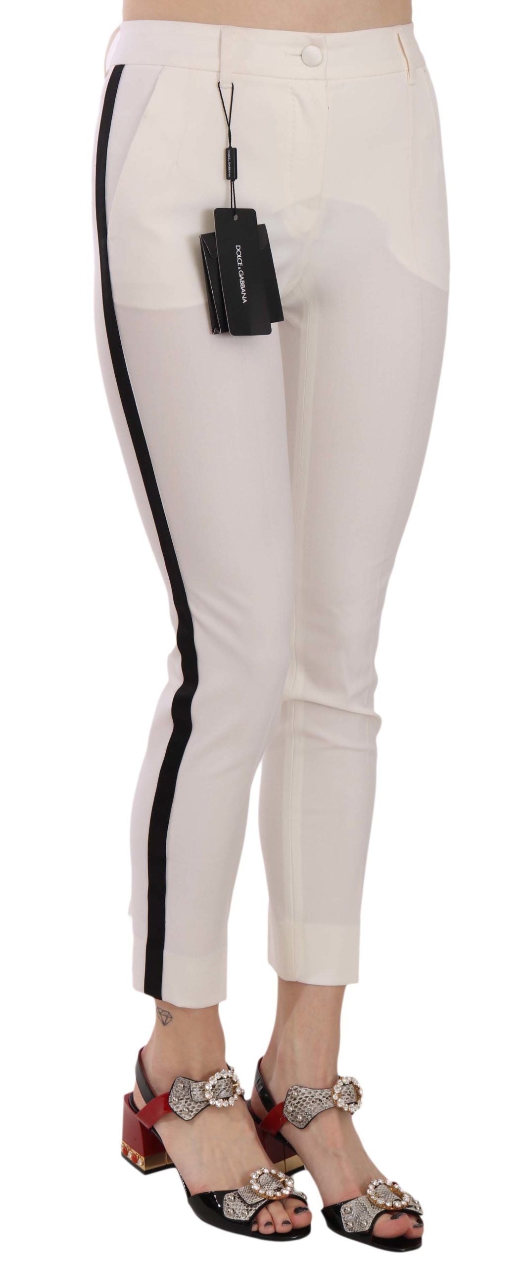 Pantalon skinny blanc Dolce & Gabbana avec rayures latérales, coupe courte, en tissu léger et élégant.