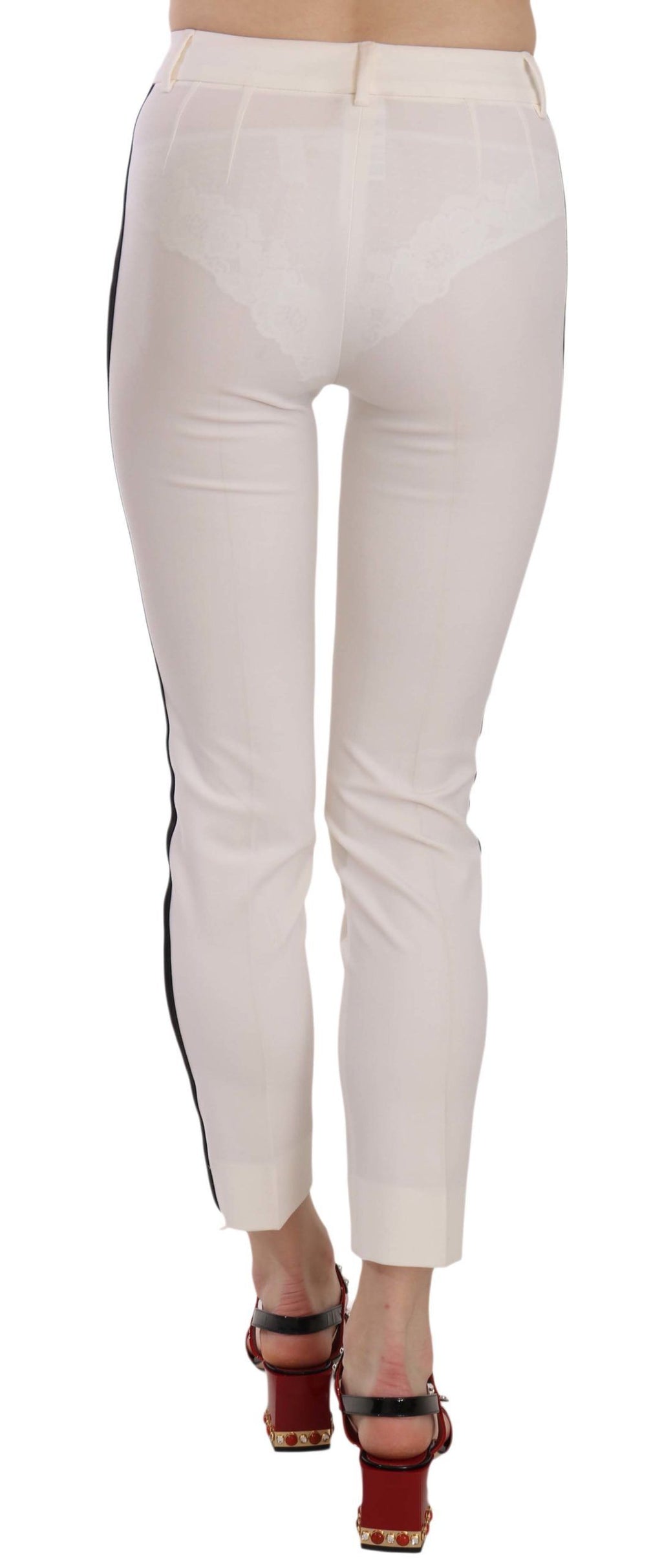 Pantalons skinny cropped blancs Dolce & Gabbana avec bande latérale, style moderne et élégant, vue de face sur fond neutre.