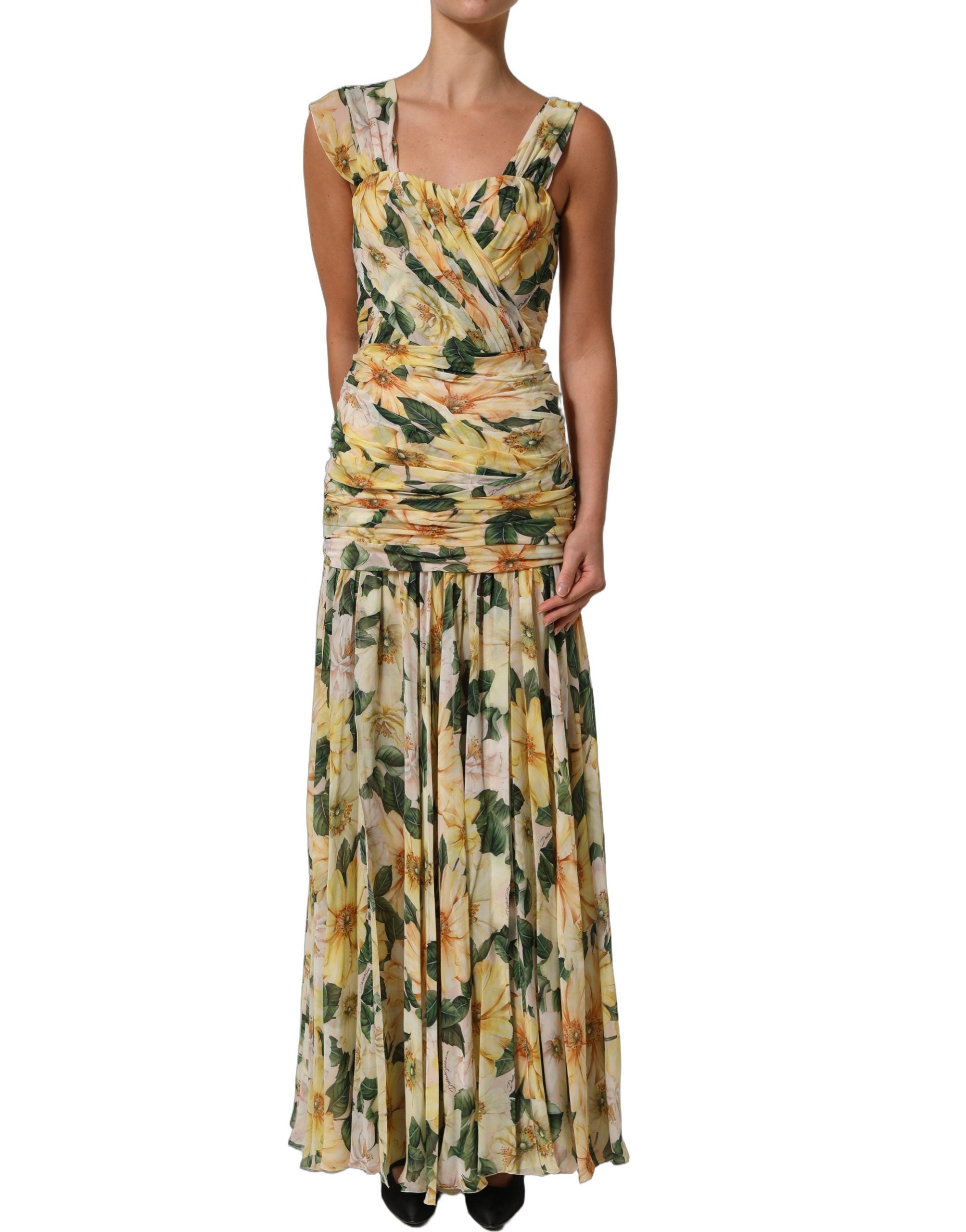 Robe longue en soie jaune à fleurs Dolce & Gabbana, plissée et élégante, avec un motif floral coloré.