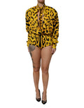 Combinaison longue Dolce & Gabbana à manches longues avec motif léopard jaune, ajustée à la silhouette.