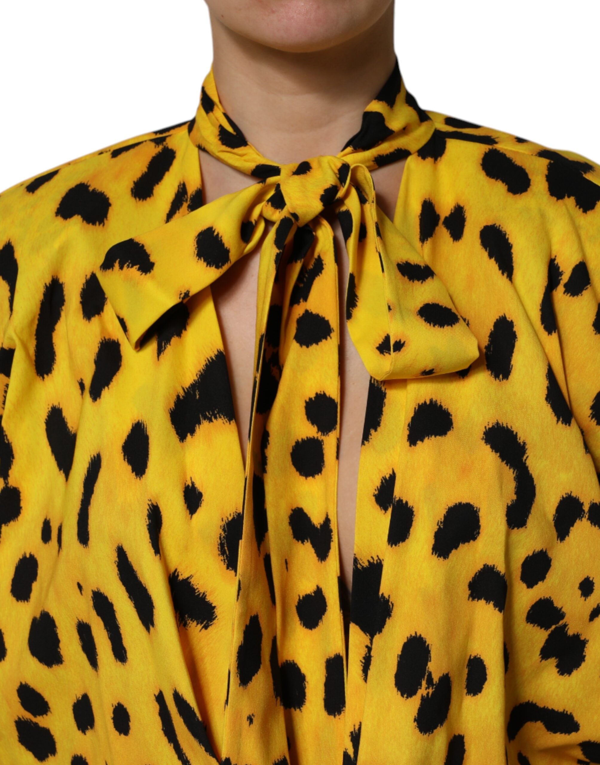 Combinaison longue Dolce & Gabbana à manches longues jaune à motif léopard, élégante et tendance.