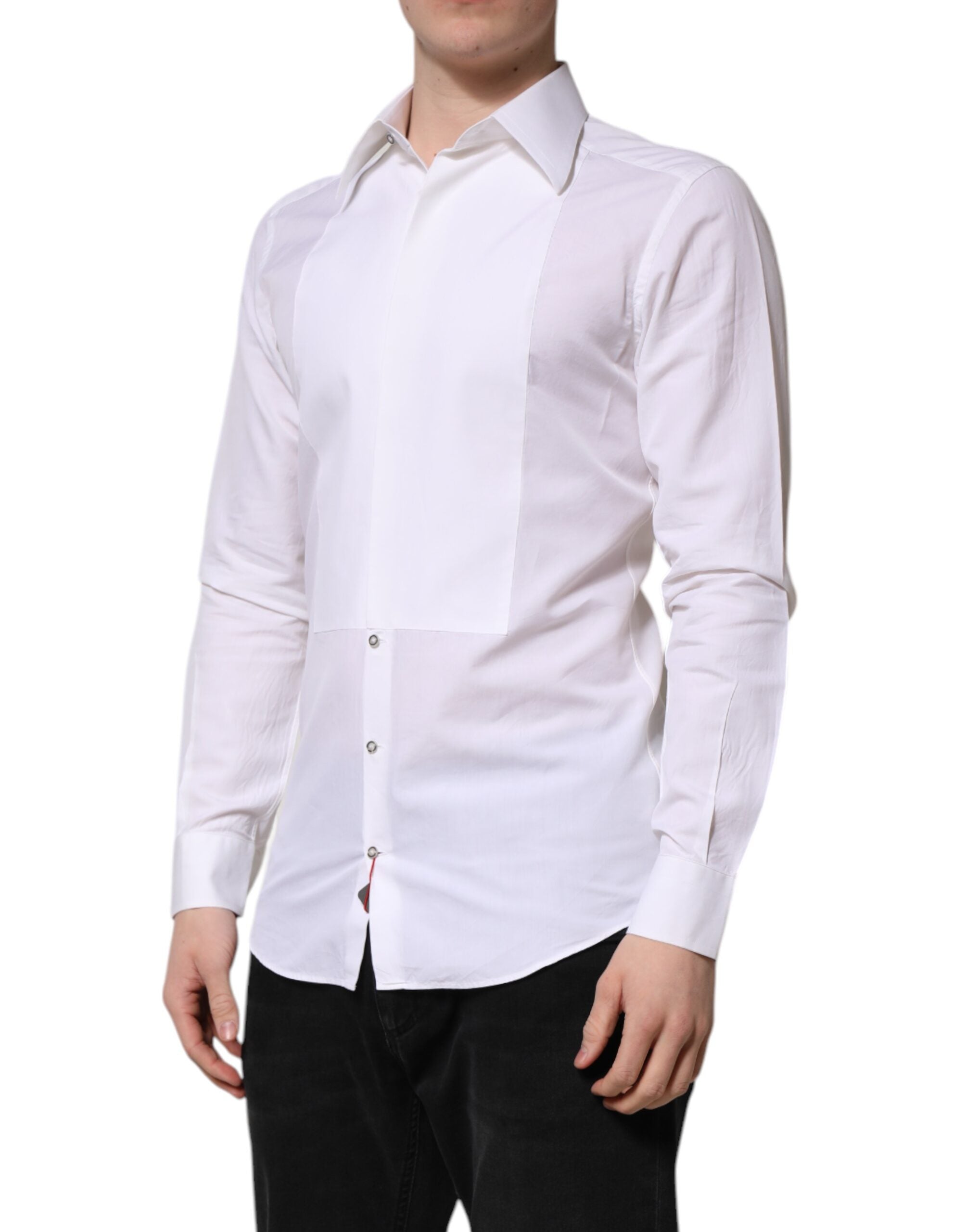 Chemise Dolce & Gabbana en coton blanc à manches longues avec détails dorés, élégante et classique.