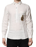 Chemise formelle blanche Dolce & Gabbana avec broderie de couronne DG, détails élégants et tissu sophistiqué.