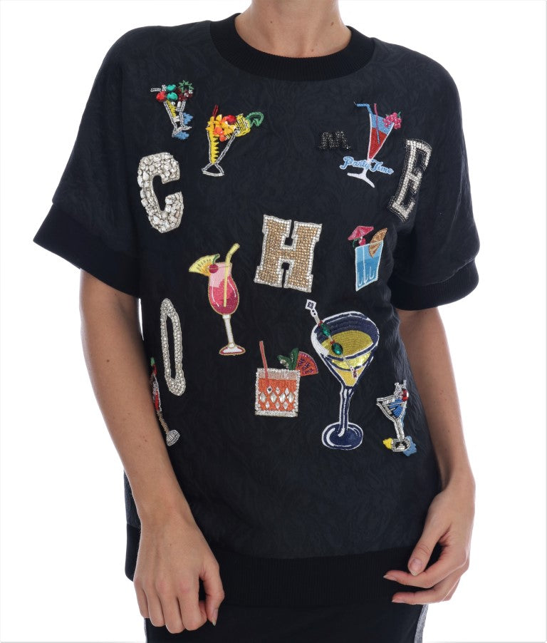 Pull Dolce & Gabbana en brocart noir avec cristaux, élégant et sophistiqué, porté sur un mannequin.