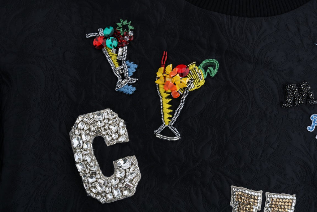 Pull Dolce & Gabbana en brocart noir avec cristaux, parfait pour cocktail, détail élégant et sophistiqué visible sur l'image.