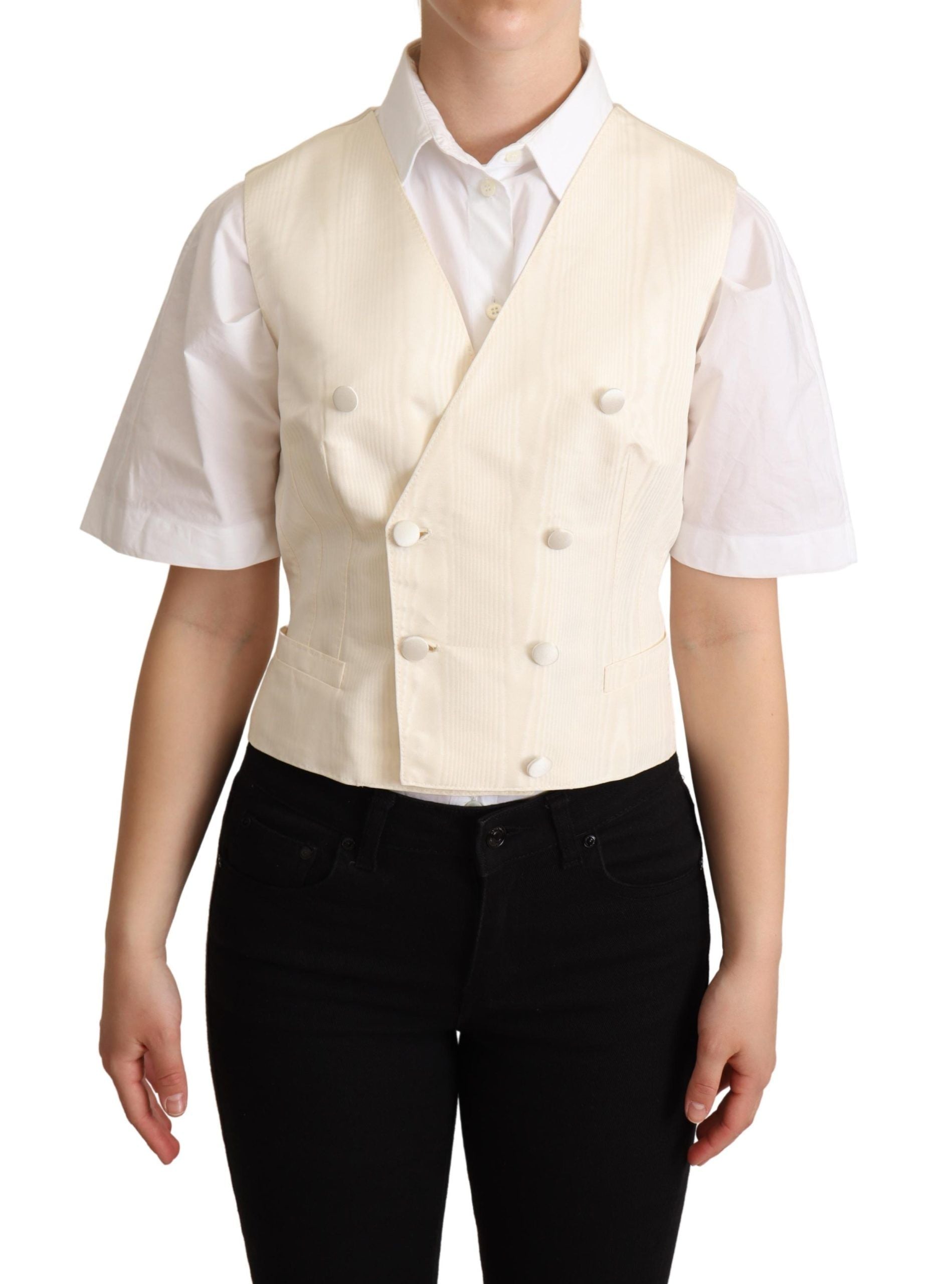 Gilet sans manches en soie beige de Dolce & Gabbana, ajusté à la taille, avec un style élégant et sophistiqué.