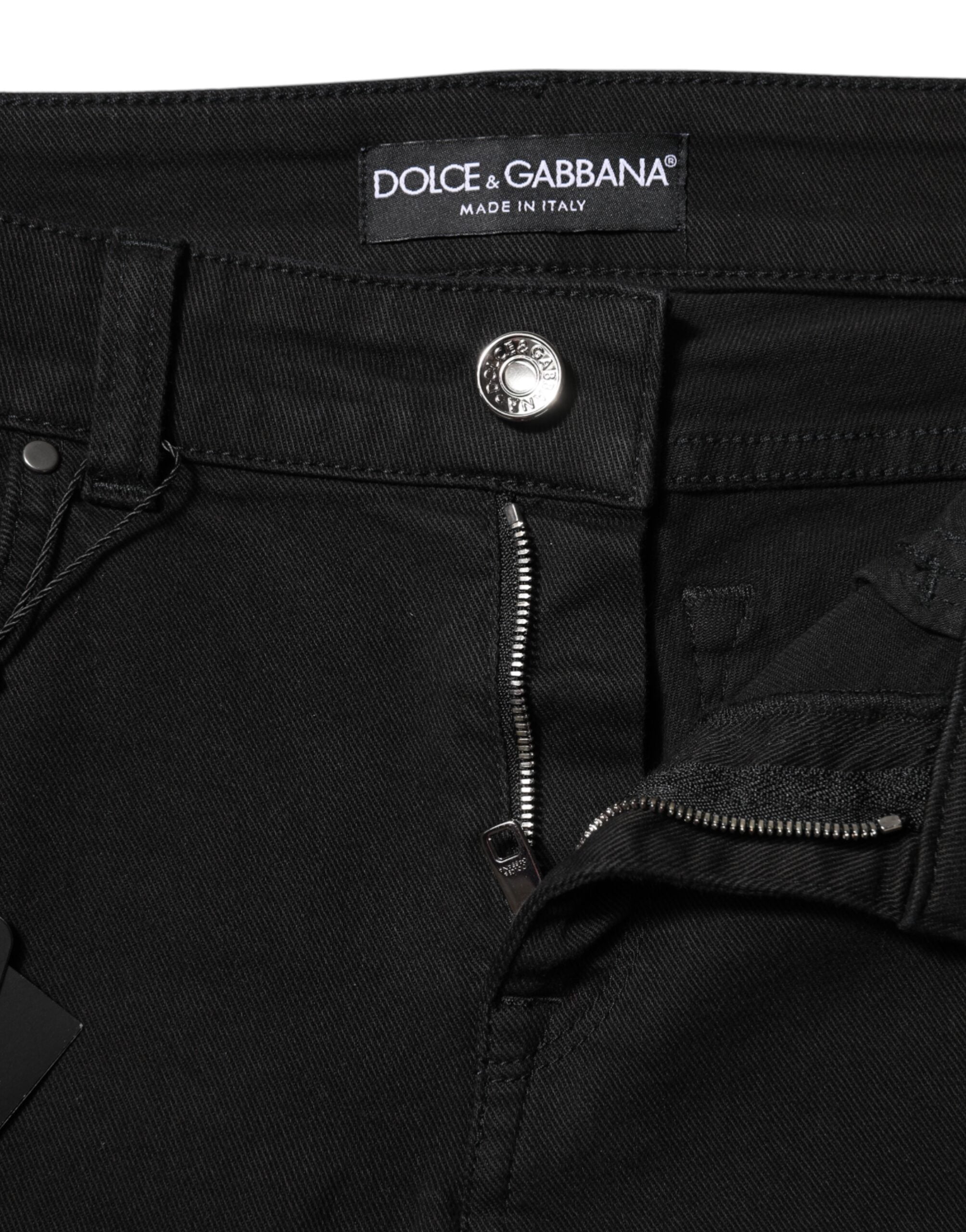 Jeans skinny noirs Dolce & Gabbana en coton avec logo, coupe mi-hauteur et taille mi, visibles avec détails de couture.