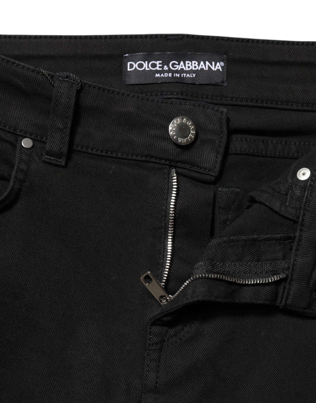 Jean slim noir en coton Dolce & Gabbana avec logo, taille mi-haute, denim ajusté et élégant.