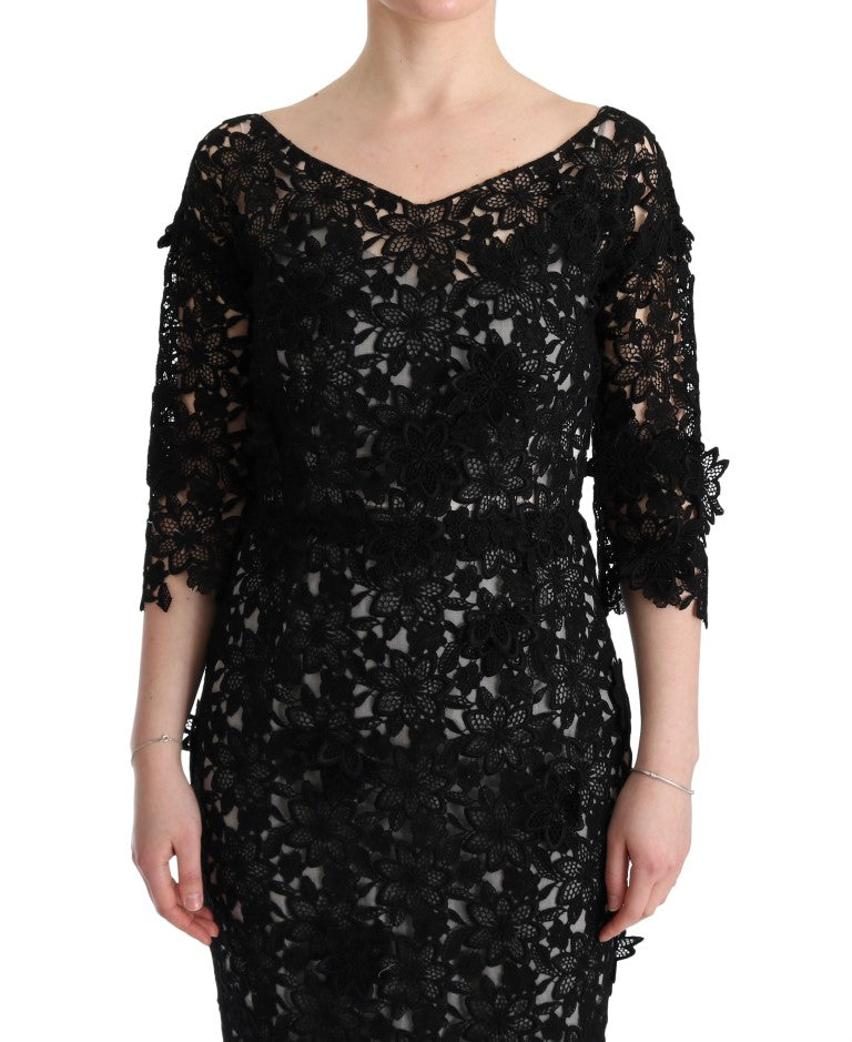 Robe longue en coton et soie noire Dolce & Gabbana avec motif floral, élégante et fluide, visible en détail.
