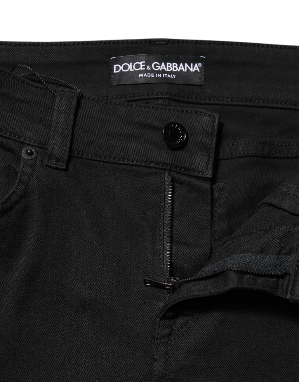 Jeans skinny en coton noir de Dolce & Gabbana, taille mi-haute, coupe ajustée, visible sur l'image.