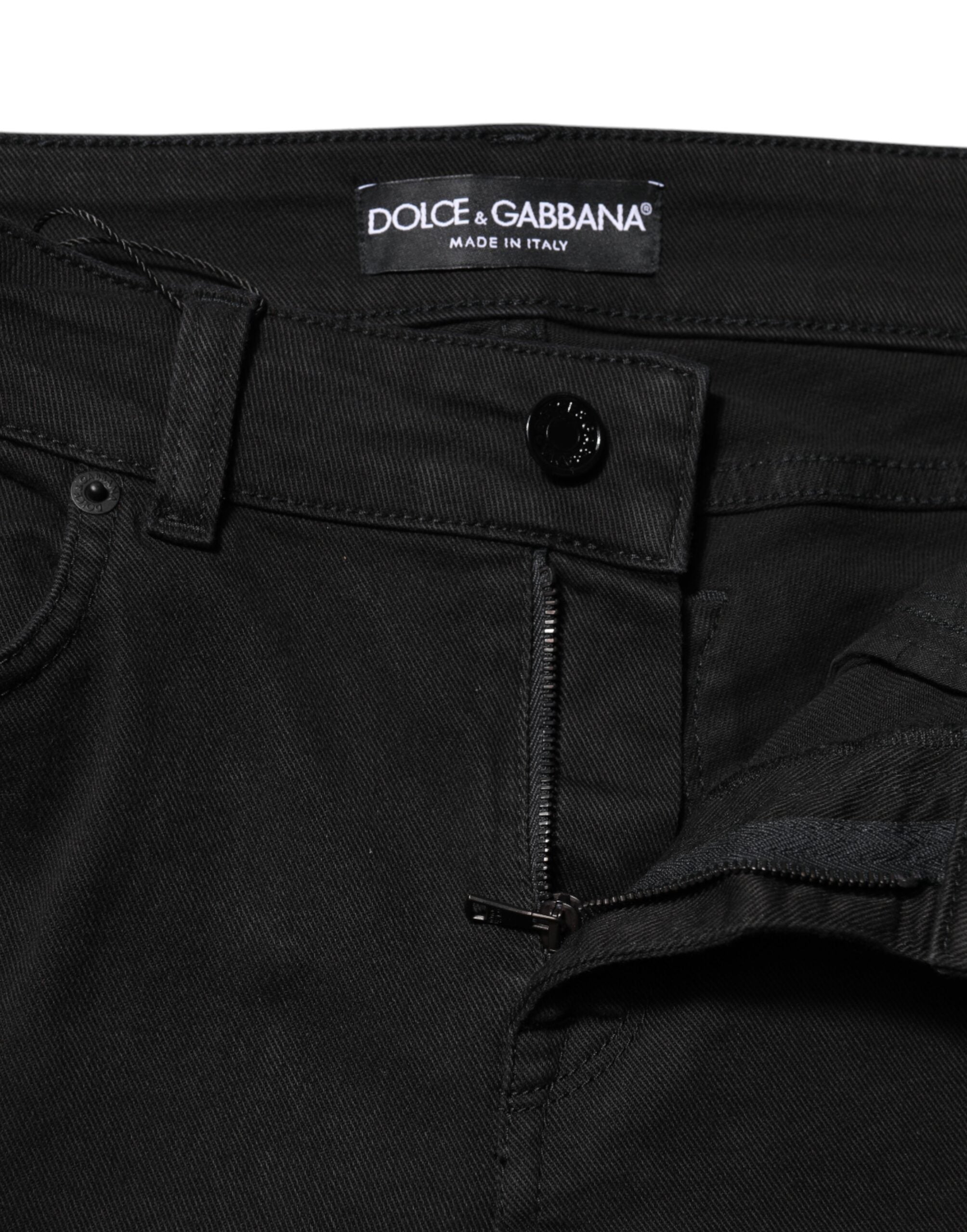 Jeans skinny en coton noir de Dolce & Gabbana, taille mi-haute, coupe ajustée, visible sur l'image.