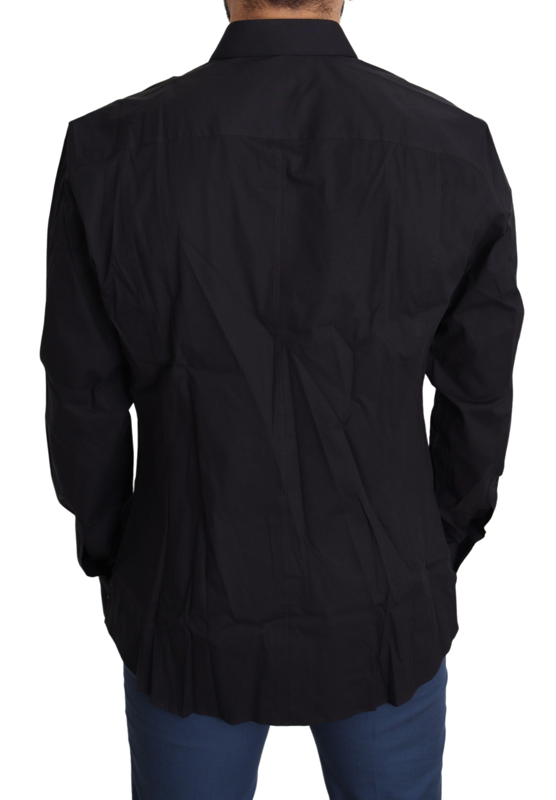 Robe noire en coton stretch Dolce & Gabbana Sicilia, coupe élégante et tissu confortable, portée avec style.