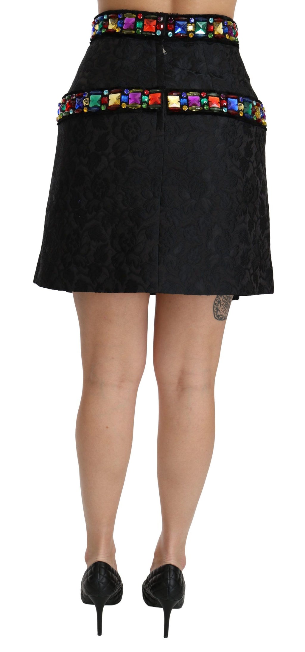 Jupe longue noire Dolce & Gabbana avec cristaux ornés et taille haute, détails élégants et sophistiqués visibles sur l'image.