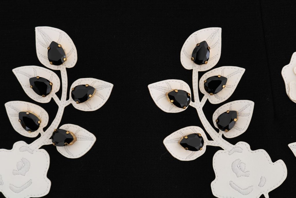 Jupe crayon noire en cristal floral de Dolce & Gabbana, détail élégant avec motifs floraux et finition raffinée.