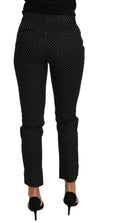 Robe noire Dolce & Gabbana avec pois, style cropped et pantalon droit, style élégant et tendance, en tissu léger.