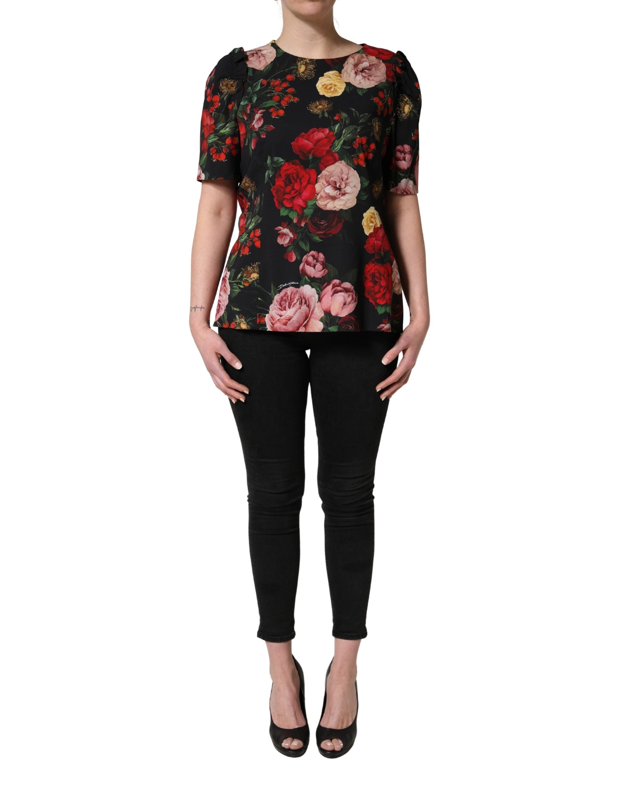 Blouse Dolce & Gabbana en crêpe noir avec détails floraux et volants, élégante et féminine.
