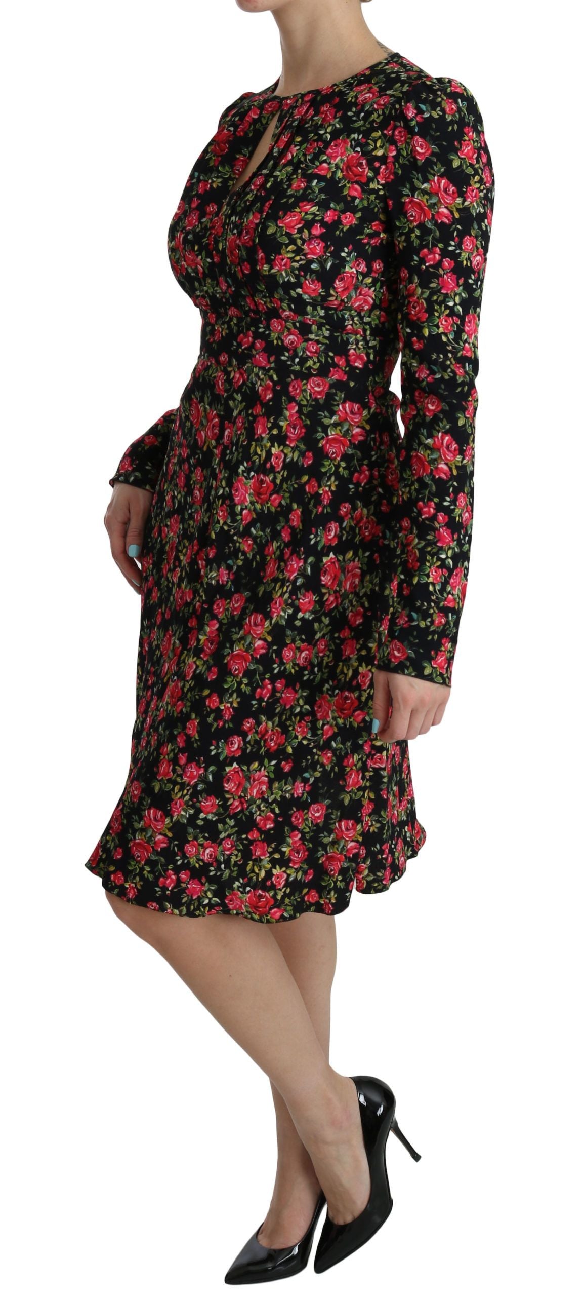 Robe longue noire à fleurs Dolce & Gabbana avec manches longues et longueur au genou, style élégant et floral.