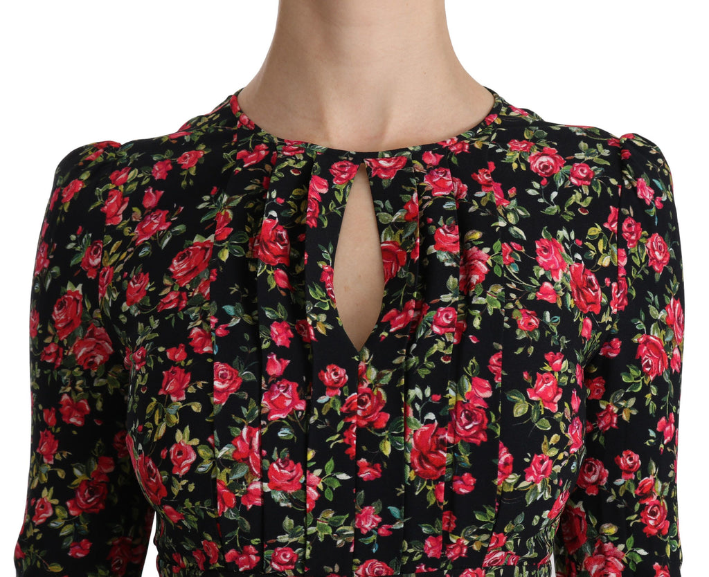 Robe longue noire à fleurs Dolce & Gabbana, manches longues, longueur jusqu'aux genoux, élégante et raffinée.
