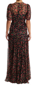 Robe de soirée noire Dolce & Gabbana avec motifs floraux de roses, coupe évasée et style élégant.