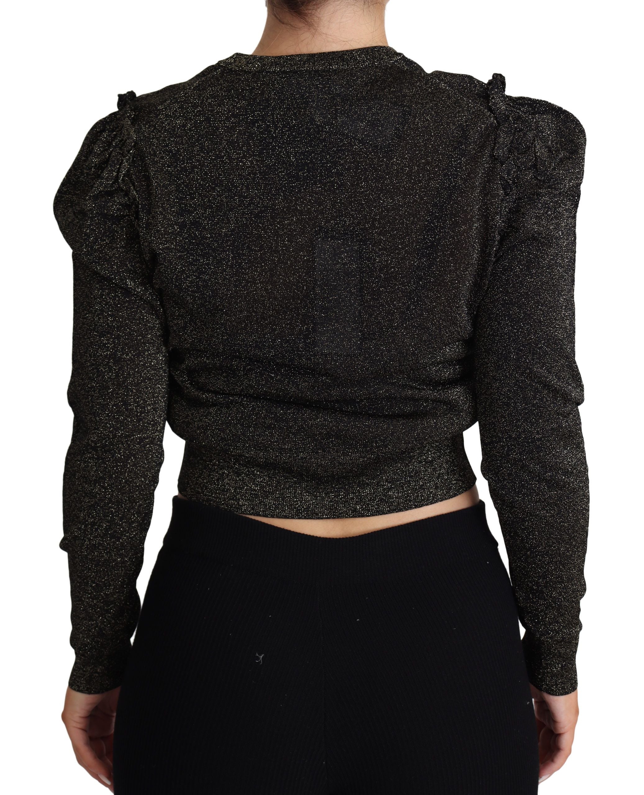 Pull femme court Dolce & Gabbana noir avec détails dorés, en maille douce et ajustée, porté sur un fond neutre.