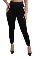 Pantalons en coton noirs Dolce & Gabbana à taille haute et dentelle skinny, élégants et ajustés, visibles sur l'image.