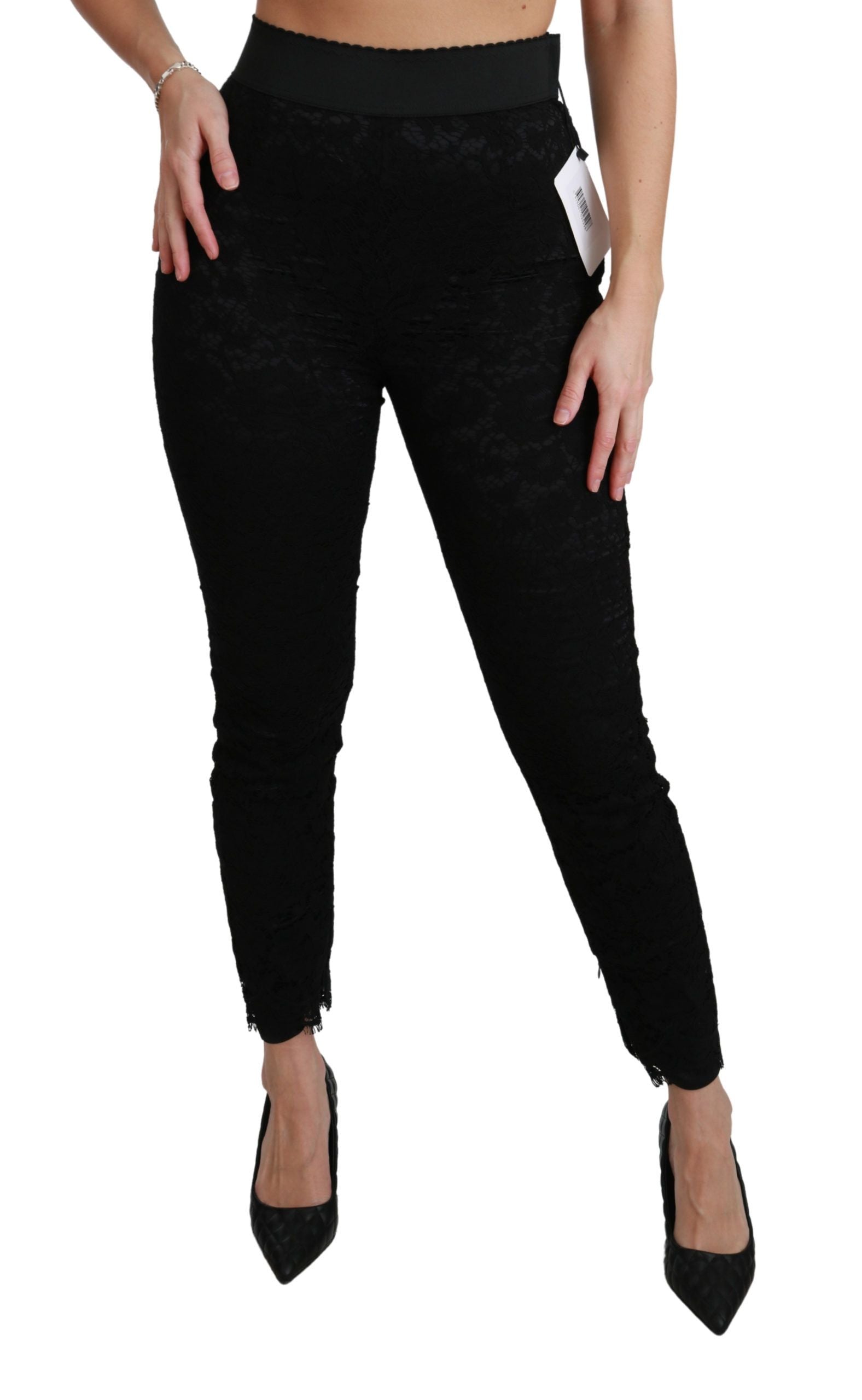 Pantalons en coton noirs Dolce & Gabbana à taille haute et dentelle skinny, élégants et ajustés, visibles sur l'image.