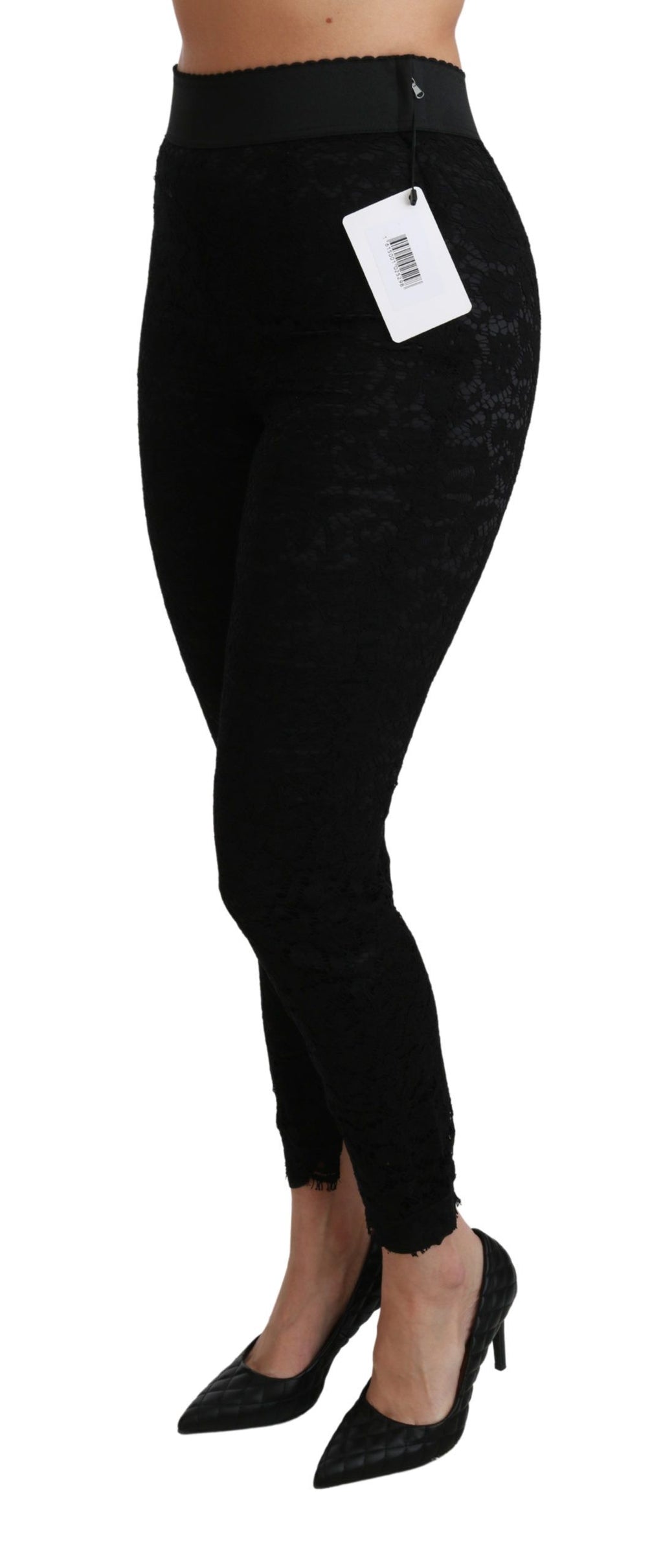 Pantalons skinny en coton noir à taille haute avec dentelle, par Dolce & Gabbana, vue de face sur fond blanc.