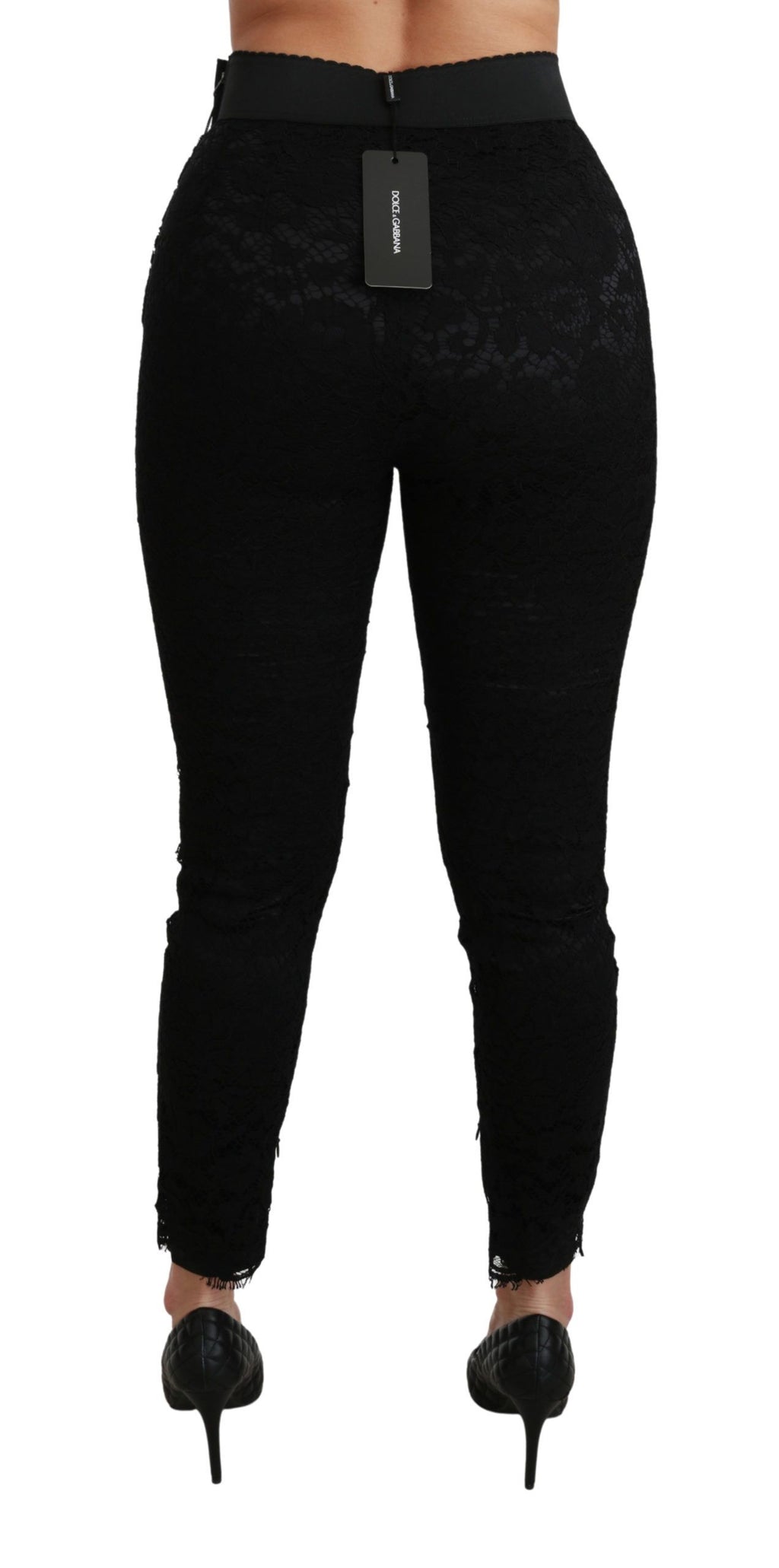 Pantalons en coton noir à taille haute et dentelle, style skinny, de la marque Dolce & Gabbana, visibles sur l'image.